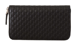 Cartera Gucci elegante de cuero negro con cremallera