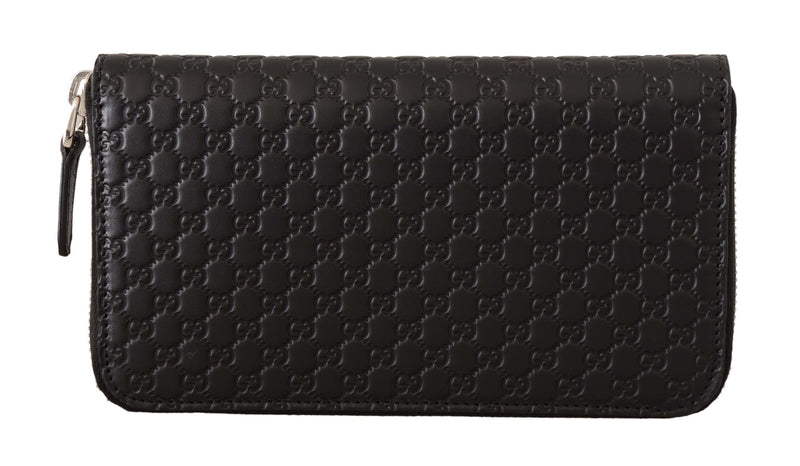 Cartera Gucci elegante de cuero negro con cremallera