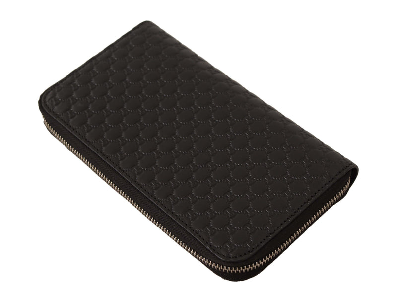 Cartera Gucci elegante de cuero negro con cremallera