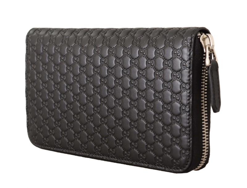 Cartera Gucci elegante de cuero negro con cremallera